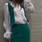 Business women in green set vest and skirt by Lola Tong in Zurich.